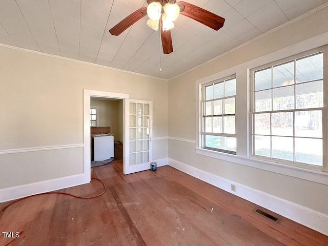 unfurnished room featuring ceiling fan, hardwood / wood-style floors, french doors, and ornamental molding