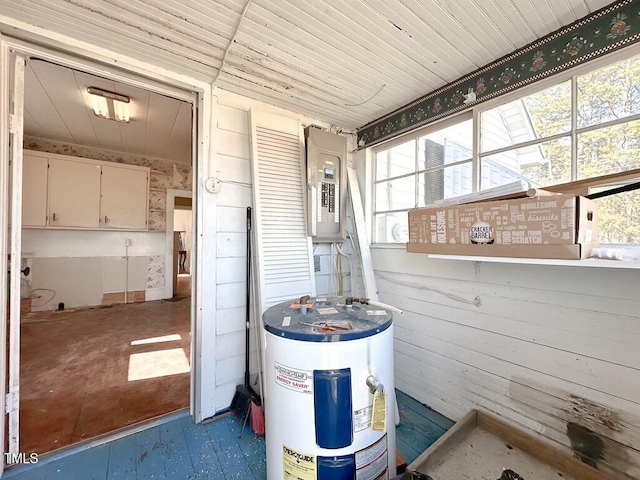 utility room featuring electric water heater and electric panel