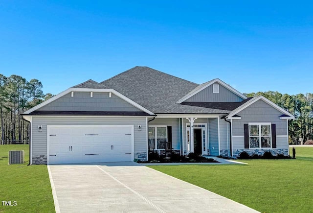 craftsman-style house featuring a front lawn and a garage