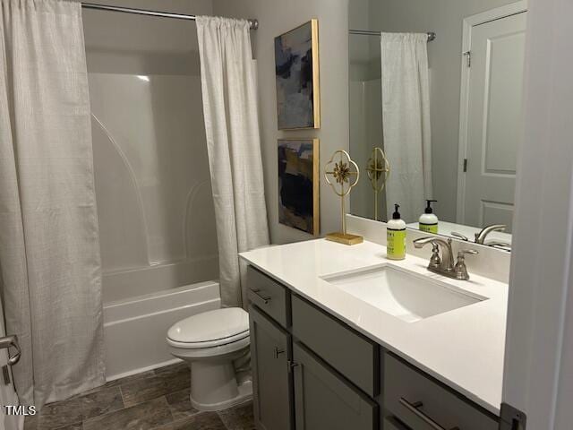 full bathroom with vanity, shower / bathtub combination with curtain, and toilet