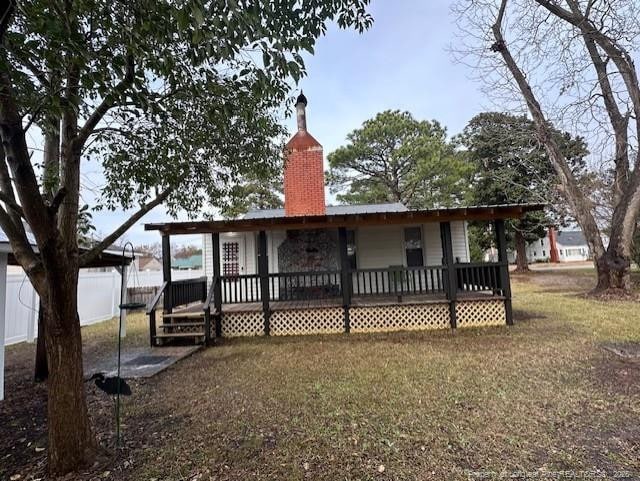1016 E 8th St, Lumberton, NC 28358 - rear view of house featuring a deck and a lawn