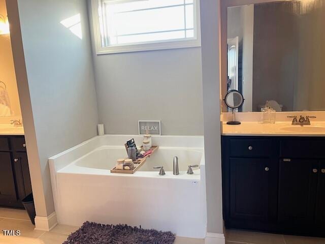 bathroom with vanity and a bathtub