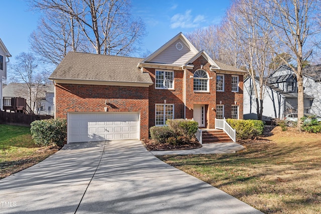 colonial home with a garage and a front lawn