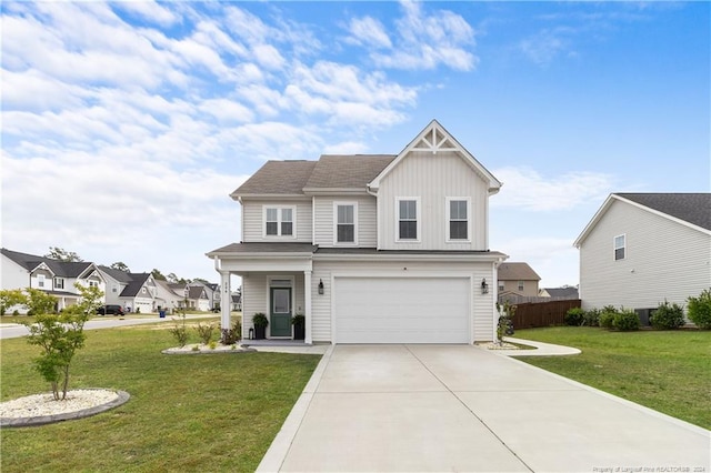 view of front of house with a garage and a front lawn