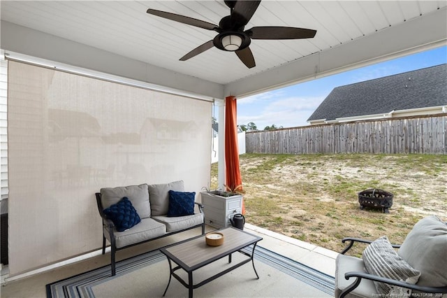 view of patio with a fire pit and ceiling fan