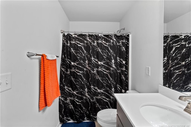 bathroom with vanity, toilet, and a shower with shower curtain