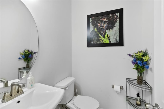 bathroom featuring a sink and toilet