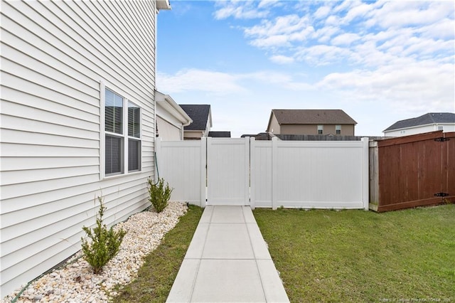 view of yard with a gate and fence