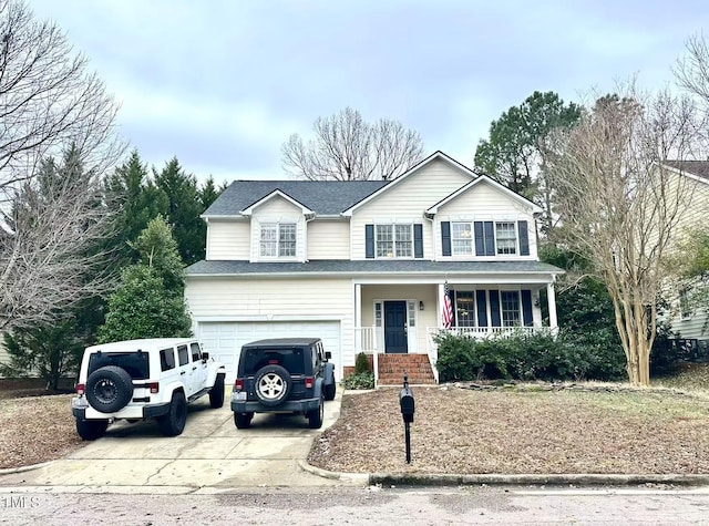 view of front of property featuring a garage and a porch