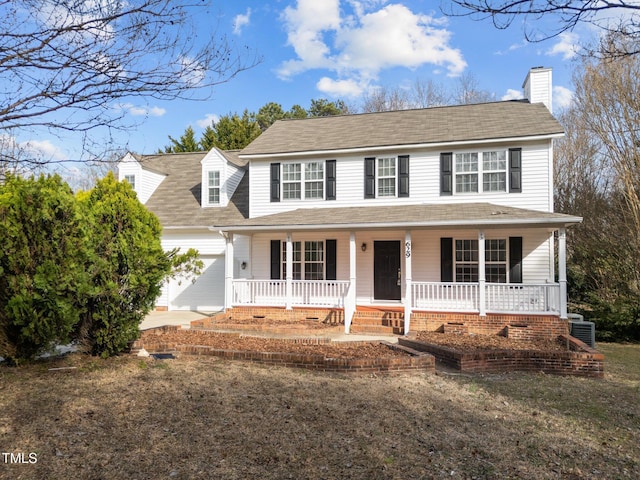 view of front of home featuring a garage, a chimney, a porch, and cooling unit