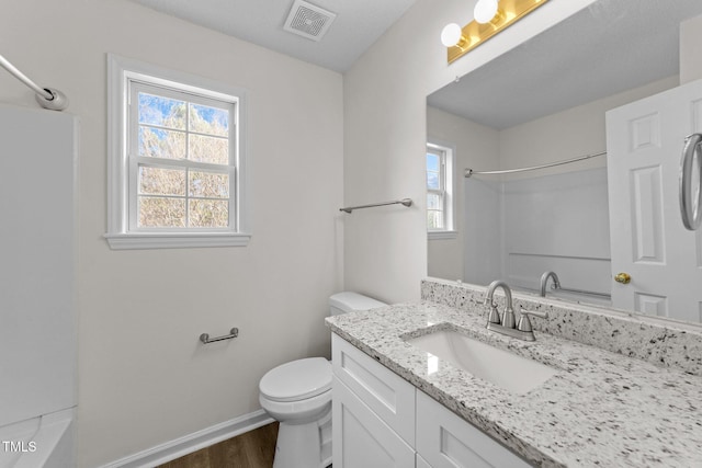 full bathroom featuring baseboards, visible vents, toilet, wood finished floors, and vanity