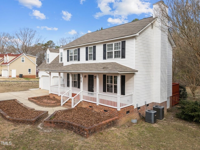 view of front of house with central air condition unit, covered porch, a garage, driveway, and crawl space