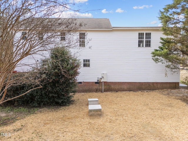 view of side of home with crawl space