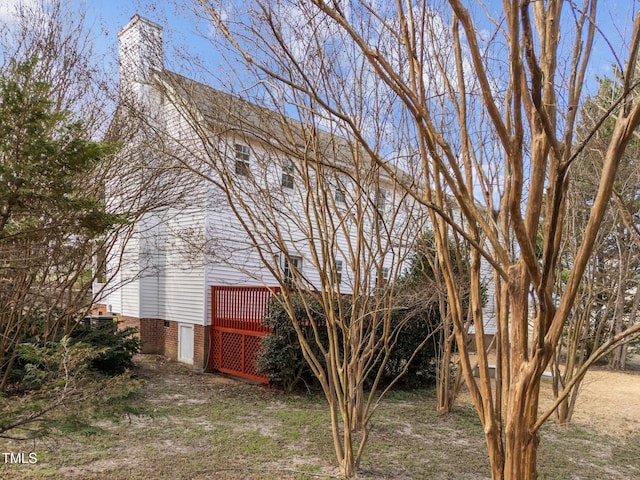 view of side of property with a chimney