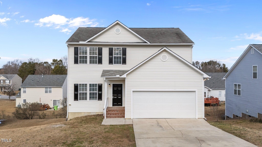 front facade featuring a garage and a front yard