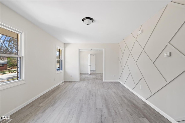 interior space featuring light hardwood / wood-style floors and plenty of natural light