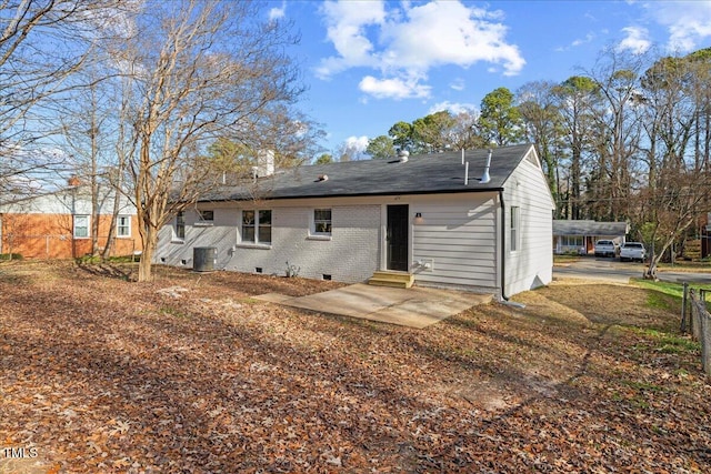 back of house with cooling unit and a patio