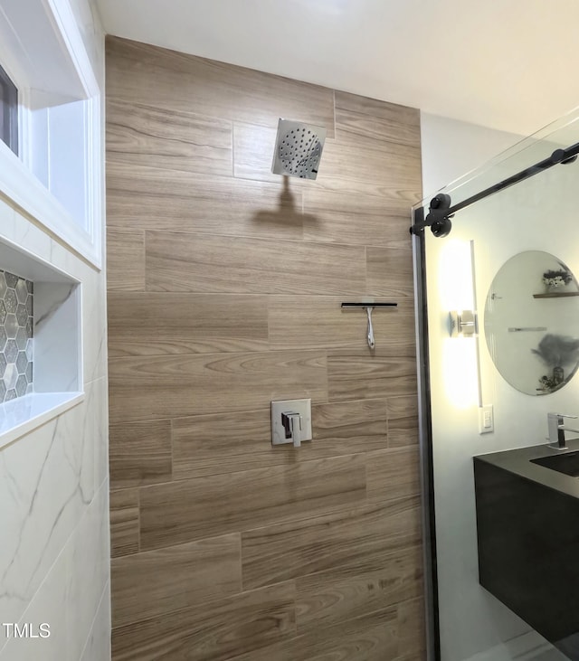 bathroom with tiled shower