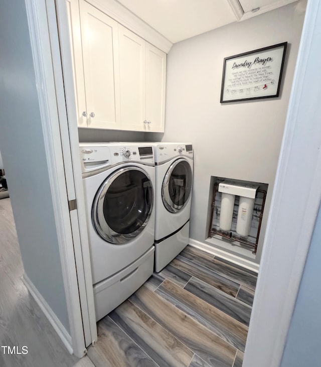 laundry area featuring cabinets and independent washer and dryer