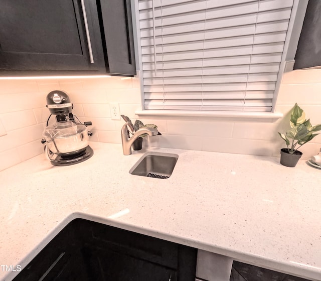 details featuring decorative backsplash and light stone counters