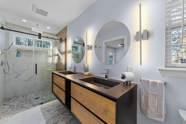 bathroom featuring vanity, tile patterned floors, and a shower with door