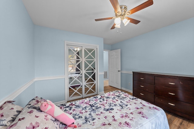 bedroom with ceiling fan and hardwood / wood-style floors