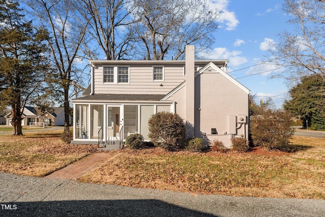 view of front facade featuring a sunroom