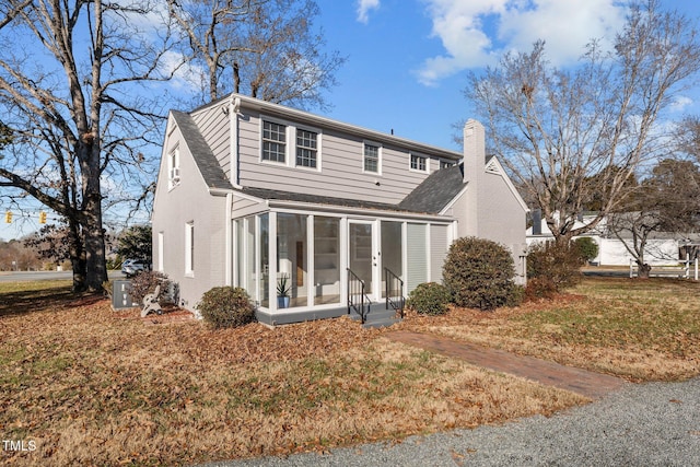 back of property featuring a sunroom