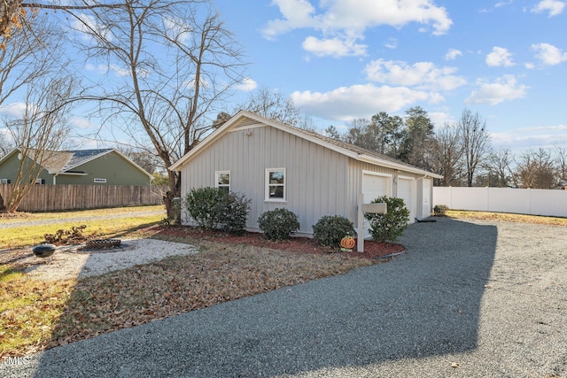 view of home's exterior featuring a garage and an outdoor structure