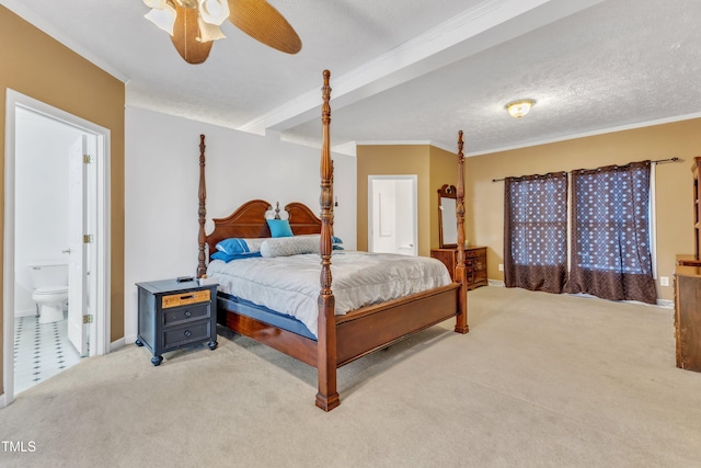 carpeted bedroom featuring beam ceiling, connected bathroom, ceiling fan, a textured ceiling, and ornamental molding