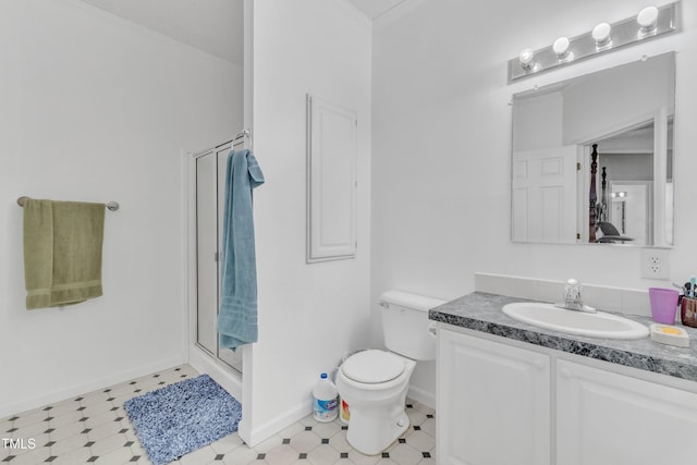 bathroom featuring walk in shower, crown molding, vanity, and toilet