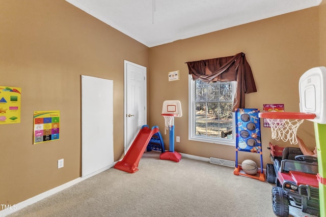 recreation room with carpet flooring