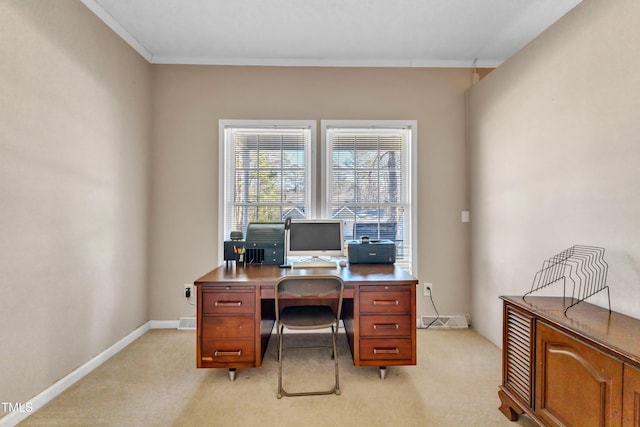 office area featuring crown molding and light carpet