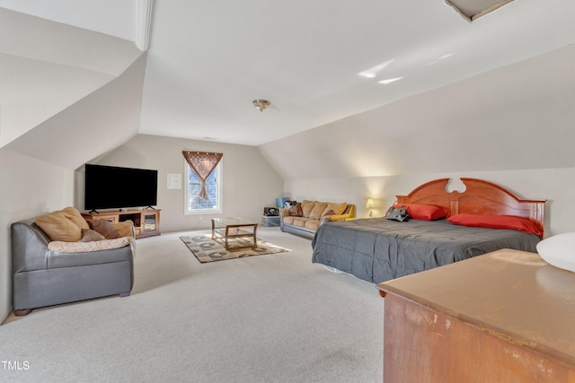 carpeted bedroom featuring lofted ceiling