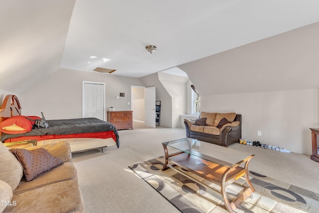 bedroom featuring carpet and lofted ceiling