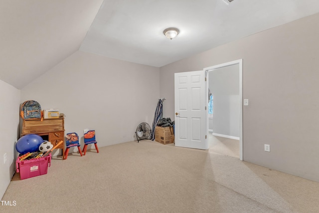 recreation room featuring carpet and lofted ceiling