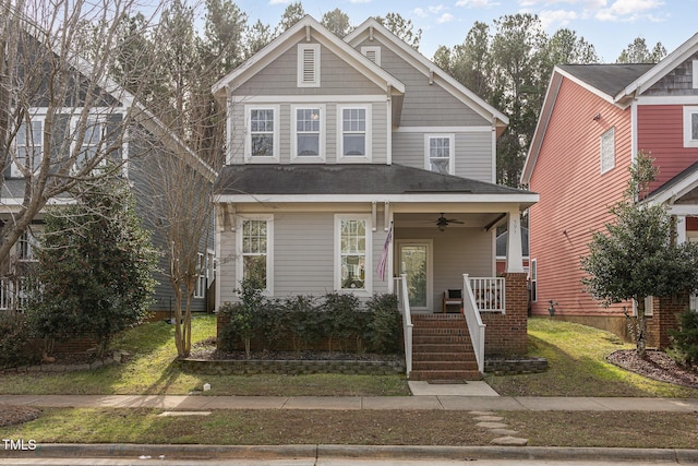 view of front of home with a porch and a front lawn