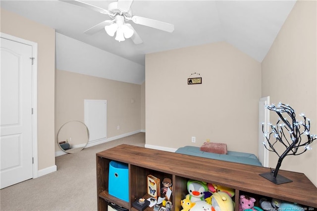 office area featuring light colored carpet, ceiling fan, and lofted ceiling