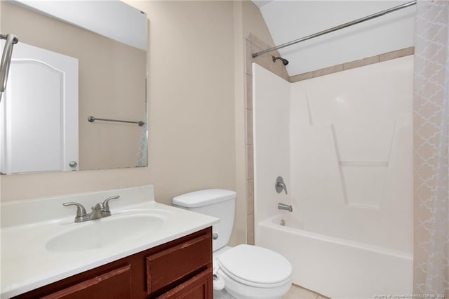 full bathroom featuring lofted ceiling, vanity, shower / bath combo, and toilet