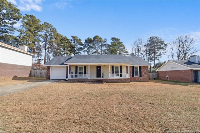 ranch-style house featuring covered porch, central AC, a garage, and a front lawn