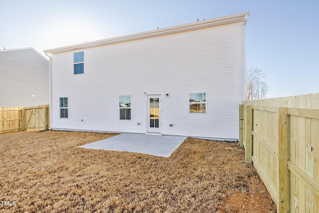 back of property with a patio area