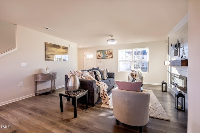 living room with dark hardwood / wood-style flooring