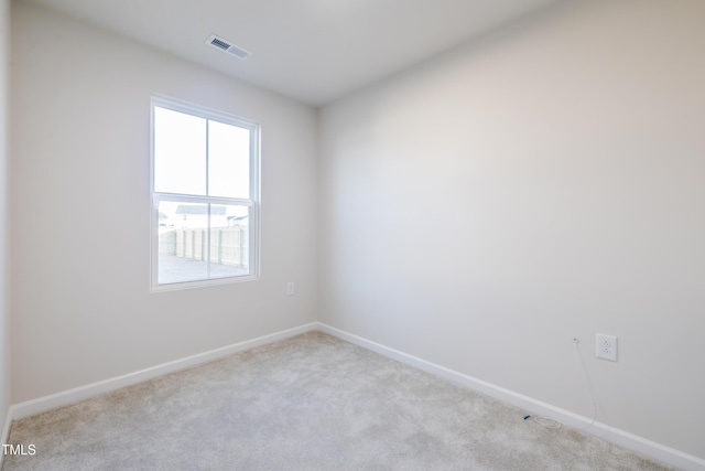 spare room with light colored carpet