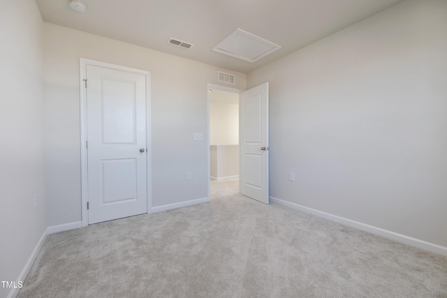 unfurnished bedroom featuring light carpet