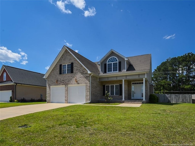 view of front of home with a front lawn and a garage