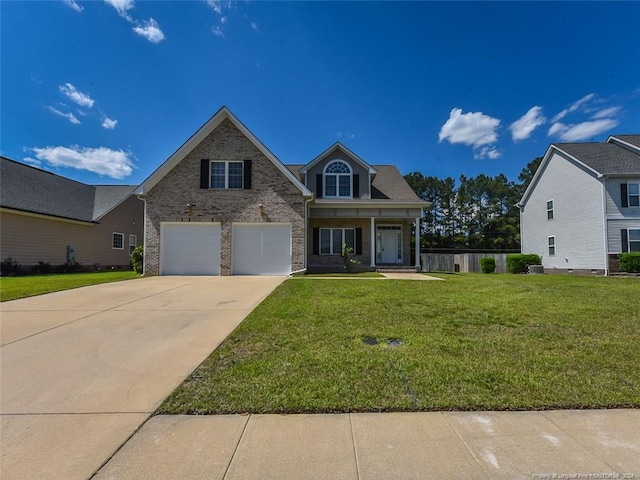 view of front of house with a front lawn and a garage