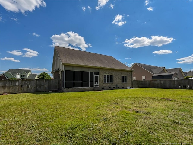 rear view of house with a lawn