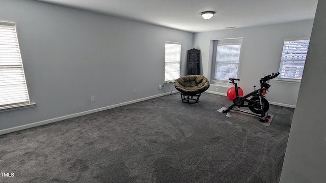 workout area featuring dark carpet