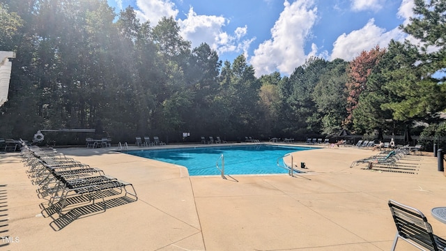 view of swimming pool featuring a patio