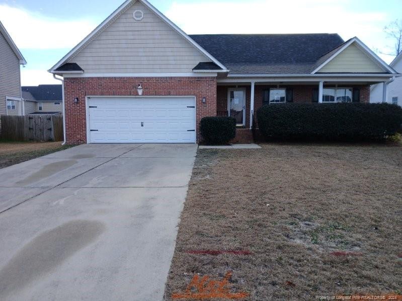 single story home featuring a garage